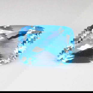 18.70 Ct Natural Swiss Blue Topaz Cushion Cut: Weight - 18.70 Ct / Dimensions - 18.20 x 13.00 x 8.80 mm / Shape & Cut - Cushion Cut / Color - Blue / Transparency - VVS / Origin - Brazil / Comments - Irradiated