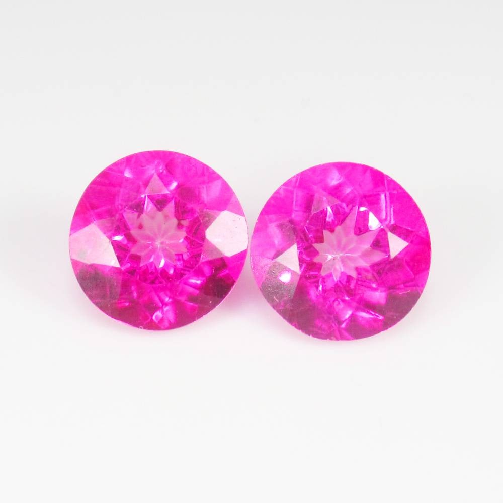 9.02 Ct Natural Pink Topaz Round Cut Twins: Weight - 9.02 Ct / Dimensions - 10.20 x 10.20 x 6.70 mm / 2 Pc's / Shape - Round Cut / Color - Pink / Clarity - VVS / Origin - Brazil / Treatment - Color Coated