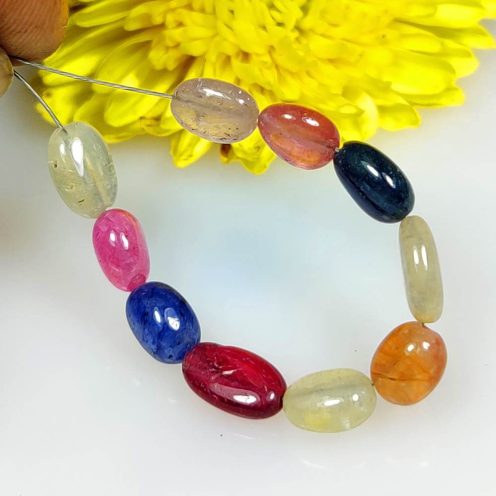 14.54 Ct Natural Multicolor Sapphire 2.2" Oval Drilled Loose Beads: Weight - 14.54 Ct / Dimensions - 6.40 x 5.20 - 8.20 x 5.10 mm / 10 Pc's / 2.2" inches / Shape & Cut - Oval Cab Beads / Color - Multicolor / Transparency - Transparent / Comments - Standard Heated