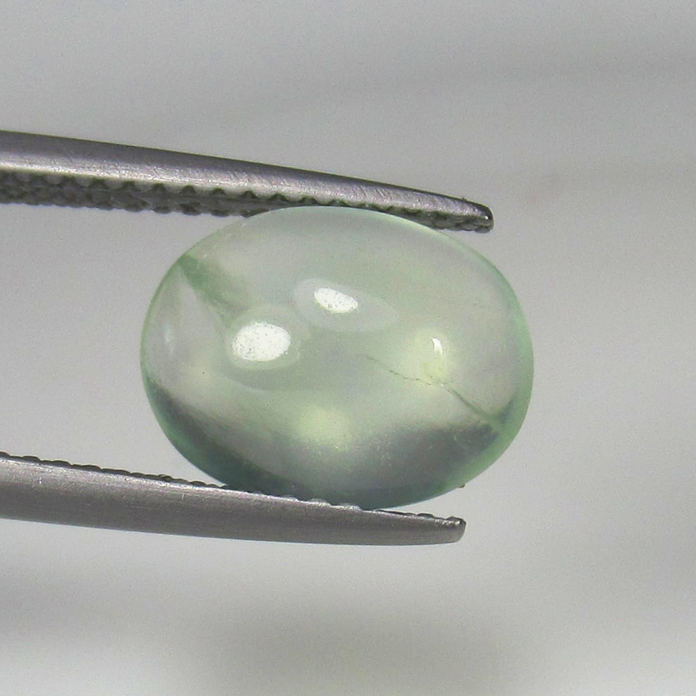 3.34 Ct Natural Green Prehnite Oval Cab: Weight - 3.34 Ct / Dimensions - 11.10 x 8.50 x 4.50 mm / Shape & Cut - Oval Cab / Transparency - Semi Transaprent / Origin - Brazil / Comments - None