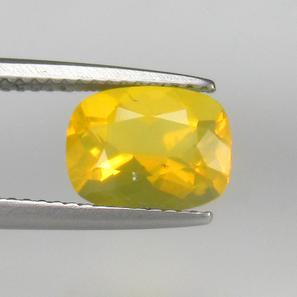 1.72 Ct Natural Mexican Opal Oval Cut: Weight - 1.72 Ct / Dimensions - 8.70 x 7.50 x 5.70 mm / Shape - Oval Cut / Color - Yellow / Clarity - Translucent / Origin - Mexico / Comments - None