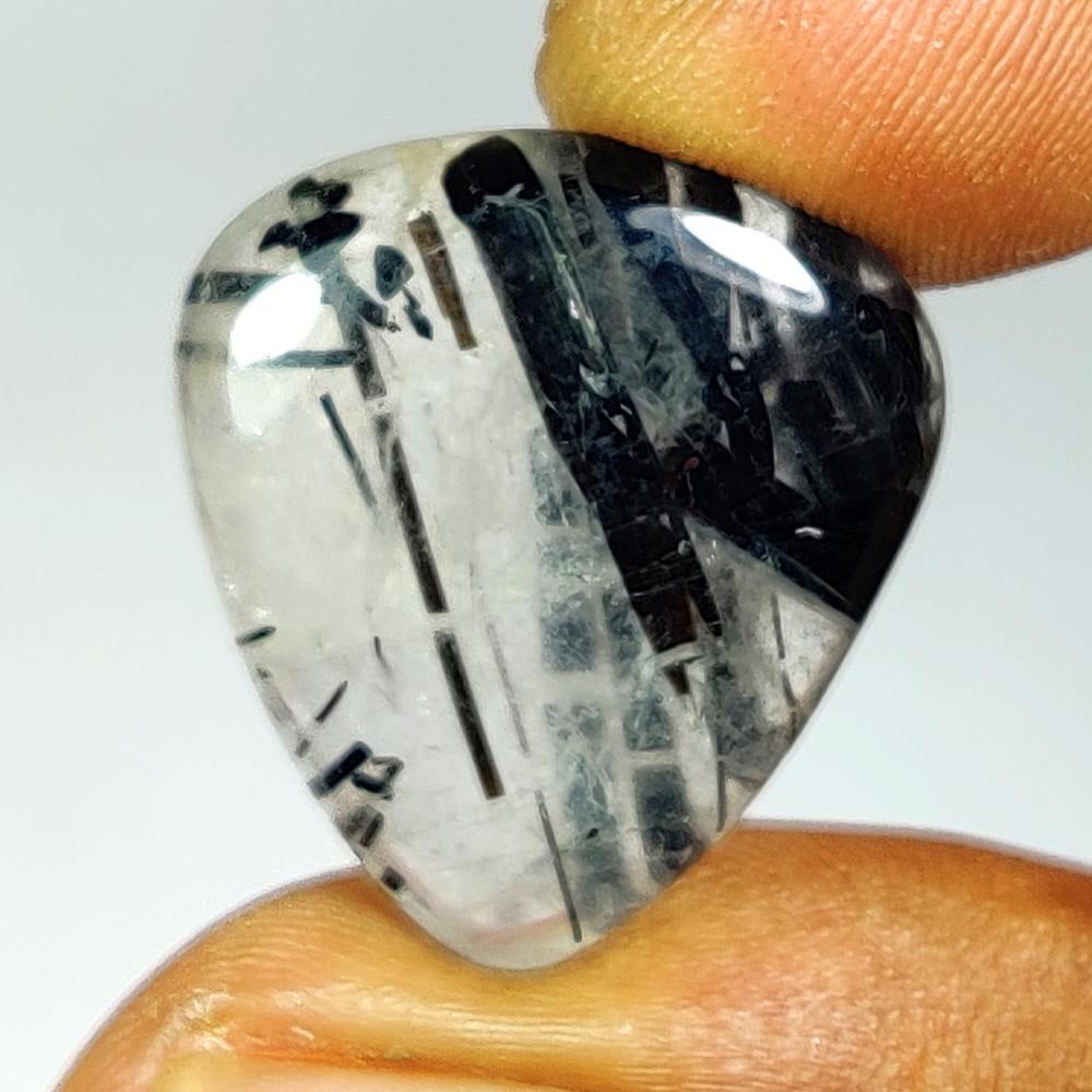 17.57 Ct Natural Black Lined Rutile Quartz Pear Cab: Weight - 17.57 Ct / Dimensions - 24.00 x 19.30 x 5.60 mm / Shape - Pear Cab / Transparency - Transparent / Origin - Norway / Treatment - None