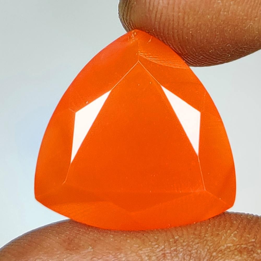 13.81 Ct Natural Orange Carnelian Trillion Cut: Weight - 13.81 Ct / Dimensions - 18.00 x 18.00 x 8.80 mm / Shape & Cut - Trillion Cut / Transparency - Semi - Transparent / Origin - Brazil