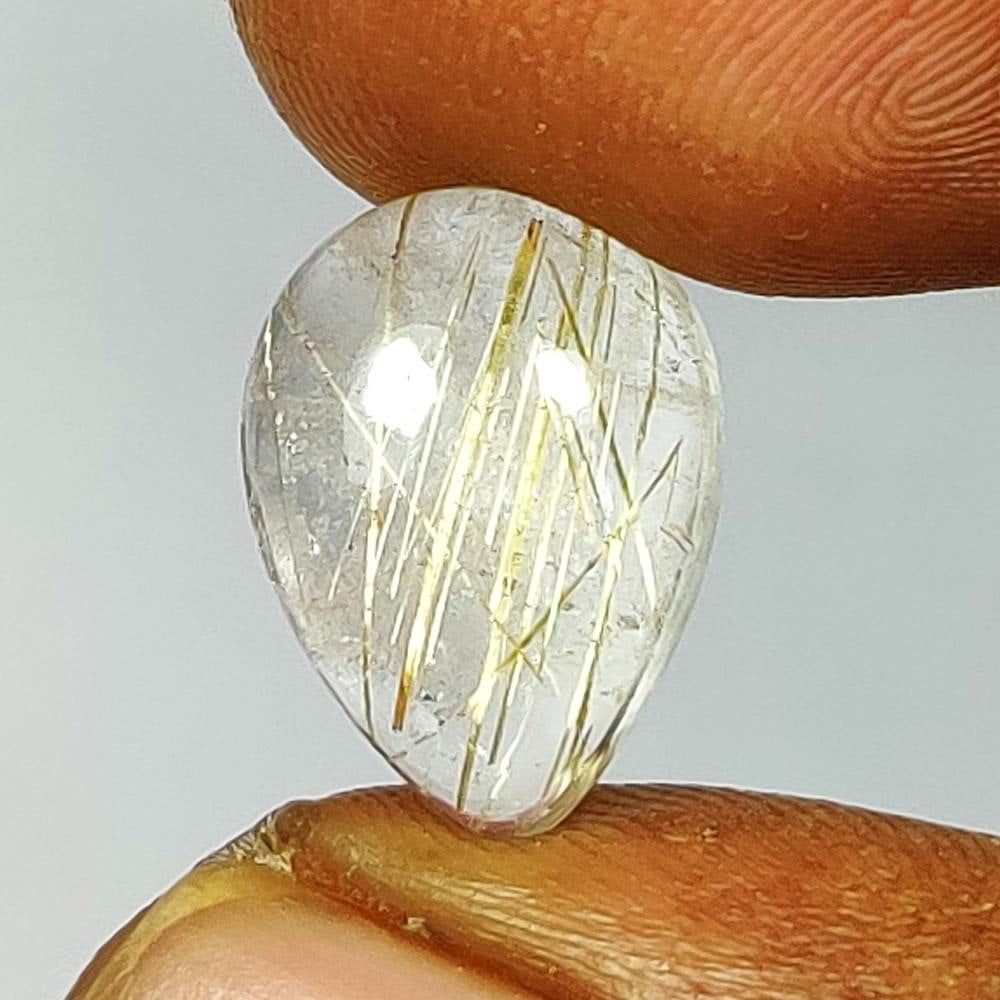 5.89 Ct Natural Golden Line Rutile Quartz Pear Cab: Weight - 5.89 Ct / Dimensions - 14.00 x 10.10 x 5.70 mm / Shape - Pear Cab / Transparency - Transparent / Origin - Norway / Treatment - None