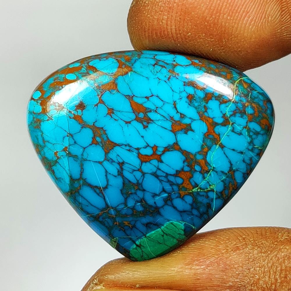 29.00 Ct Natural Peruvian Chrysocolla Pear Cab: Weight - 29.00 Ct / Dimensions -30.00 x 26.00 x 6.10 mm / Shape - Pear Cab / Transparency - Semi-Transparent / Origin - Congo / Treatment - None
