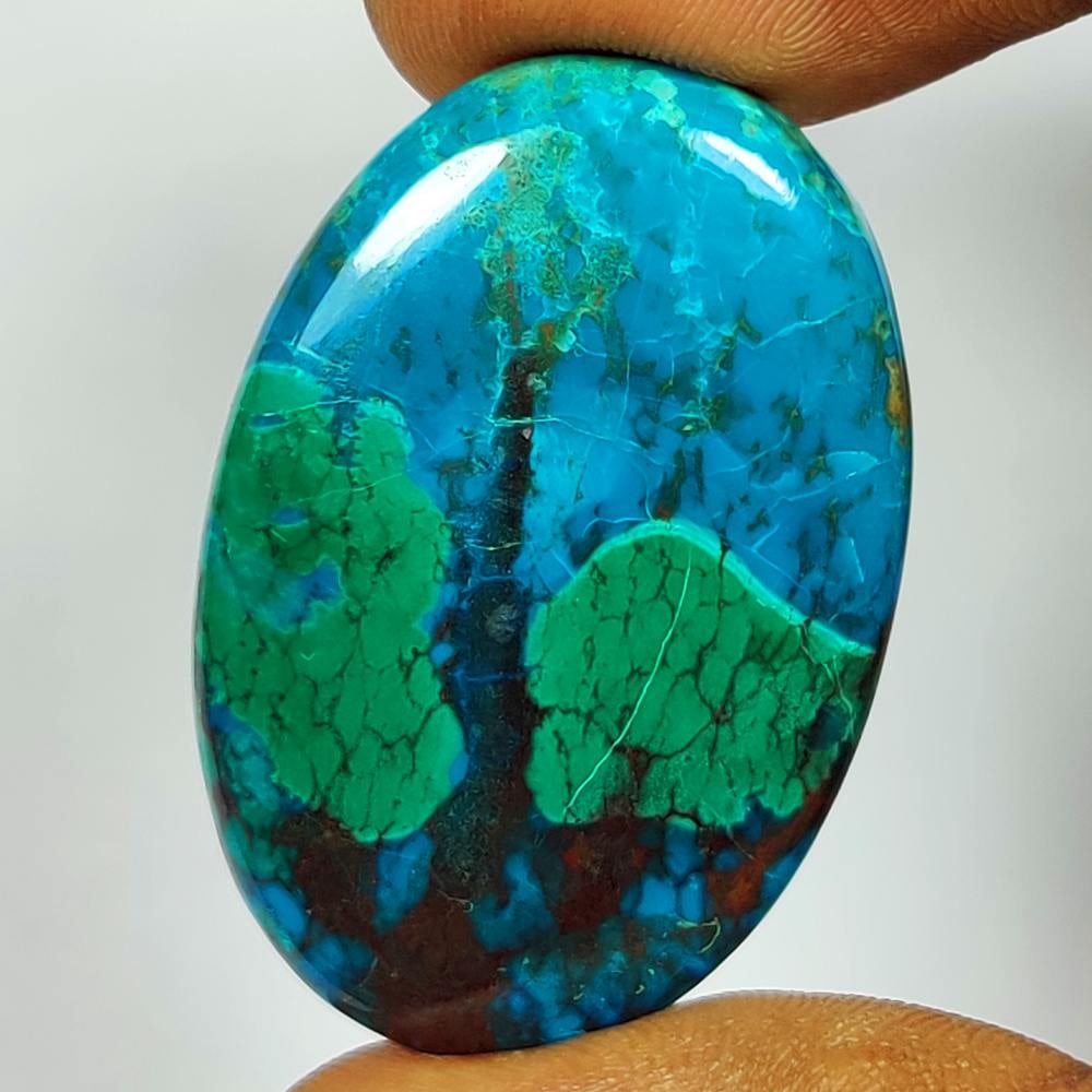 43.51 Ct Natural Peruvian Chrysocolla Oval Cab: Weight - 43.51 Ct / Dimensions - 37.00 x 25.00 x 5.60 mm / Shape - Oval Cab / Transparency - Semi-Transparent / Origin - Congo / Treatment - None