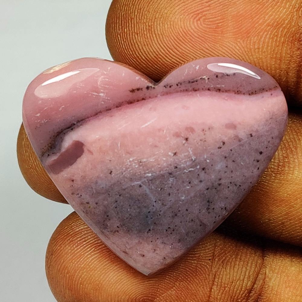 36.75 Ct Natural Peru Pink Opal Heart Cab: Weight - 36.75 Ct / Dimensions - 34.00 x 29.00 x 6.00 mm / Shape - Heart Cabochon / Transparency - Semi-Transparent / Origin - Peru / Treatment - None
