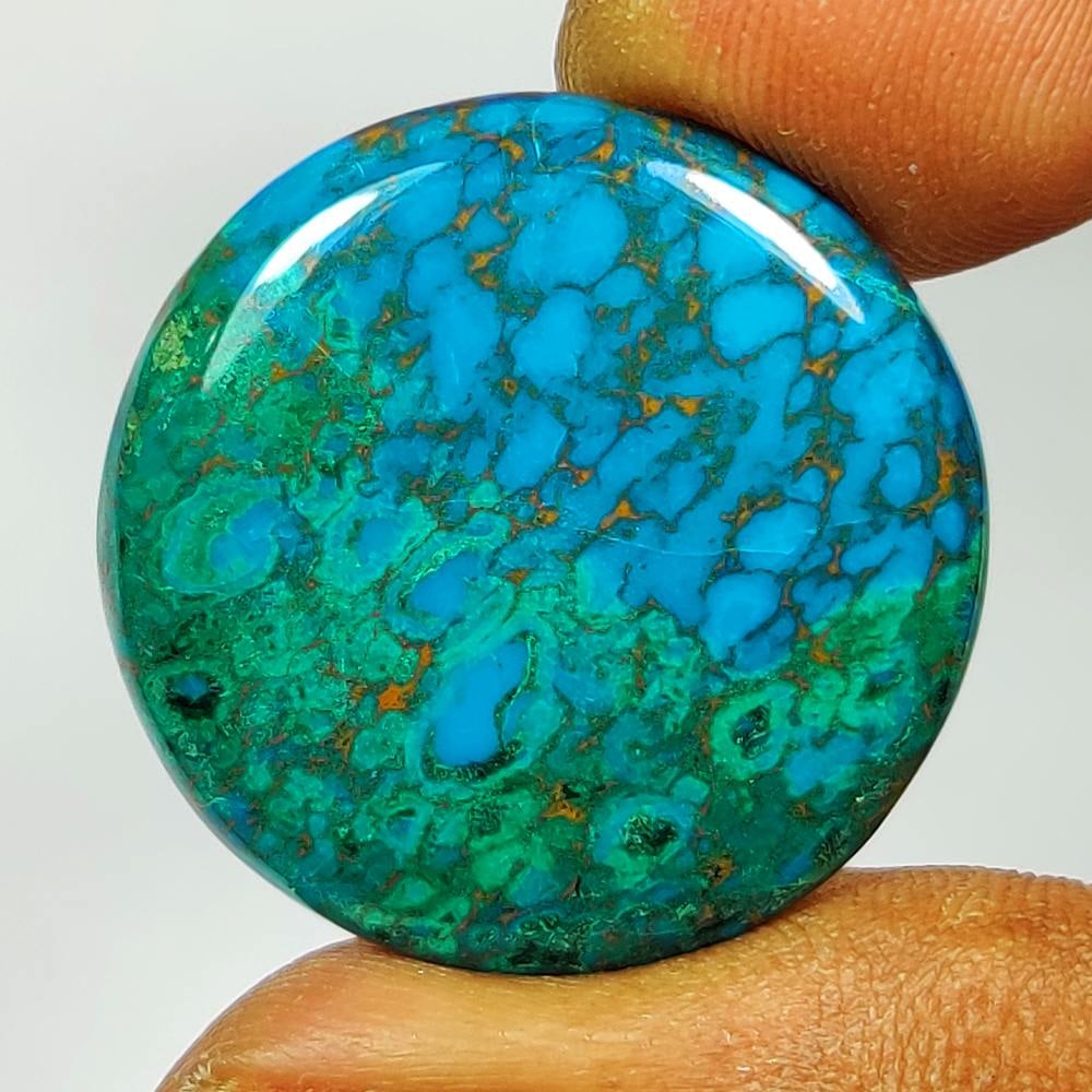 29.74 Ct Natural Peruvian Chrysocolla Pear Cab: Weight - 29.74 Ct / Dimensions - 27.00 x 27.00 x 4.70 mm / Shape - Round Cab / Transparency - Semi-Transparent / Origin - Congo / Treatment - None
