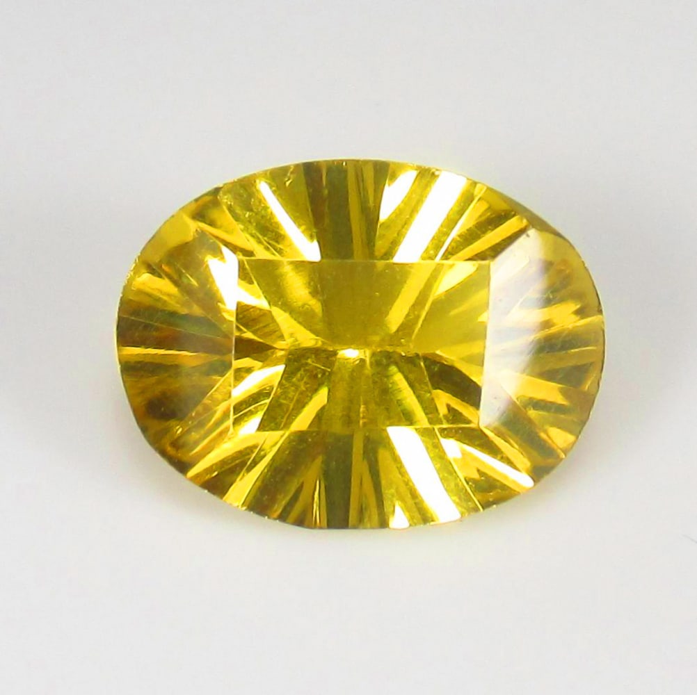 6.23 Ct Natural Yellow Citrine Oval Laser Cut: Weight - 6.23 Ct / Size - 14.50 x 11.00 x 7.10 mm / Shape - Oval Laser Cut / Color - Yellow / Clarity - VVS / Origin - Brazil / Treatment - Heated