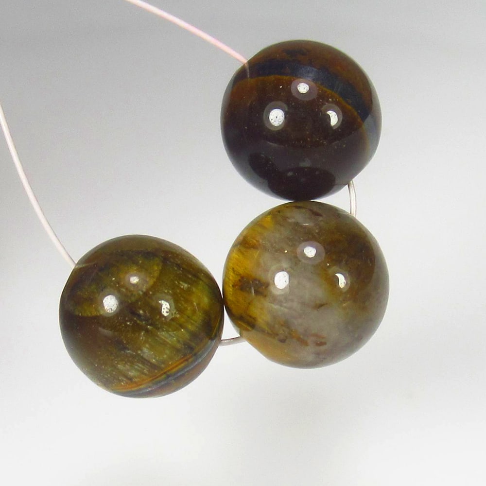 11.25 Ct Natural Tiger Eye Round Ball Beads: Weight - 11.25 Ct / Dimensions - 7.80 - 8.20 mm / 3 Pc's / Top Class Quality / Round Ball Beads / Origin - Burmese / Comments - None