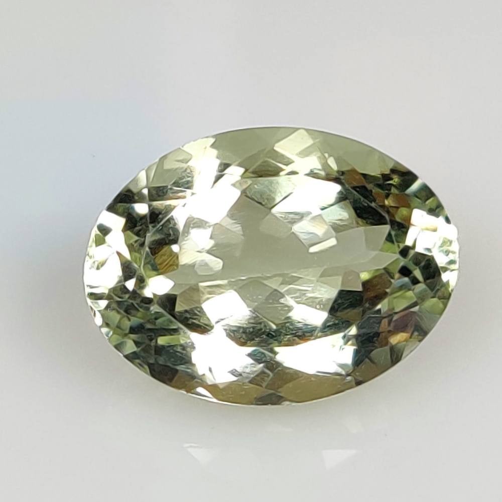 14.09 Ct Natural Green Amethyst Oval Cut: Weight - 14.09 Ct / Size - 18.40 x 13.80 x 9.60 mm / Shape - Oval Cut / Color - Green / Clarity - VVS / Origin - Brazil / Treatment - Heated