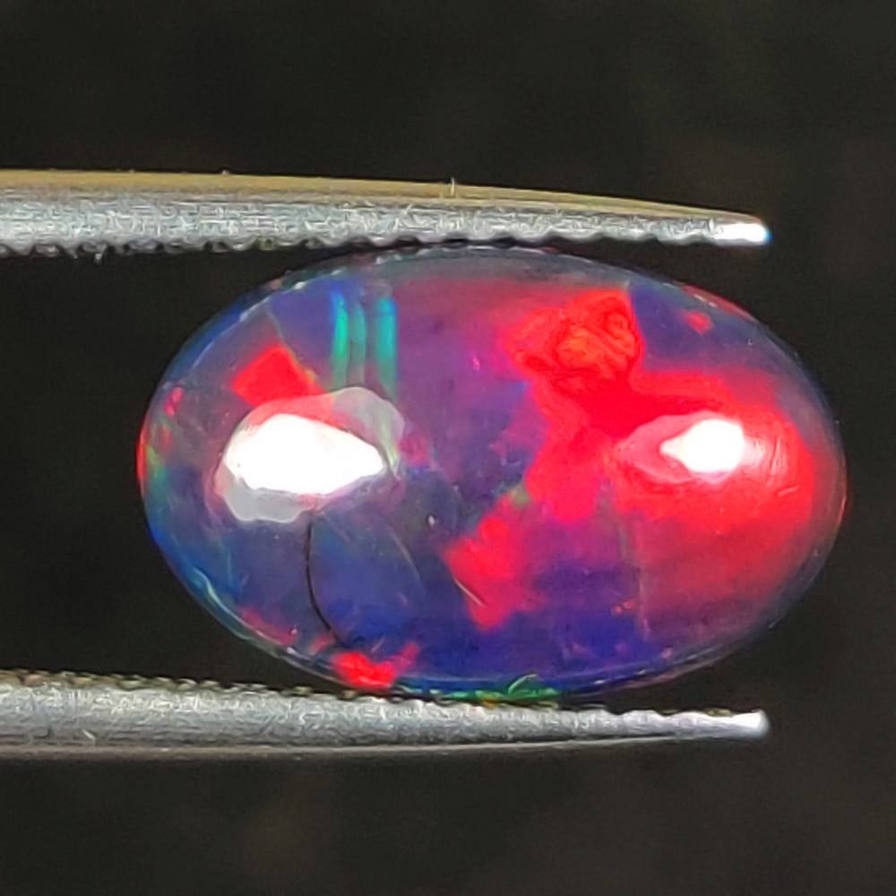 1.83 Ct Natural Black Flashing Fire Opal Oval Cab (1 of 2)