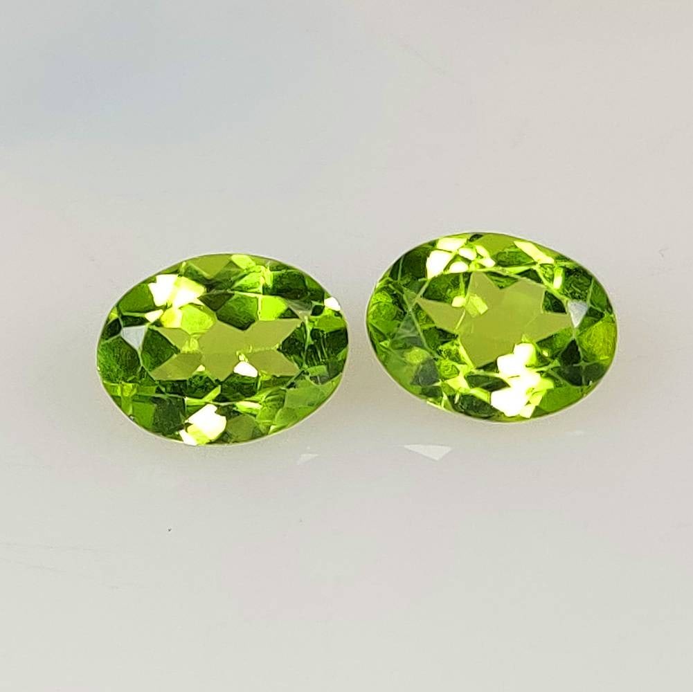 2.59 Ct Natural Green Peridot Oval Cut Pair: Weight - 2.59 Ct / Dimensions - 8.20 x 6.20 x 3.90 mm / 2 Pc's / Shape - Oval Cut / Color - Green / Clarity - VVS / Origin - Pakistan / Treatment - None