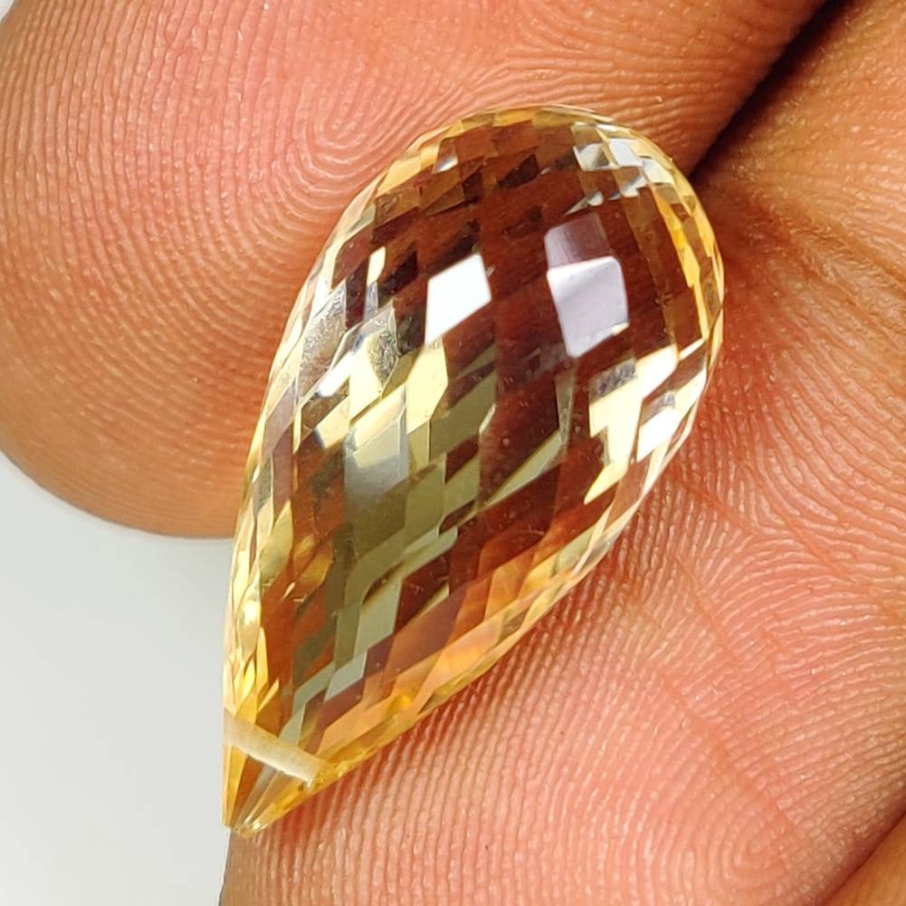 12.69 Ct Natural Yellow Citrine Drilled Pear Drop: Weight - 12.69 Ct / Dimensions -20.40 x 10.40 x 10.40 mm / Shape & Cut - Drilled Pear Drop / Color - Yellow / Clarity - VVS / Origin - Brazil / Comments - Heated