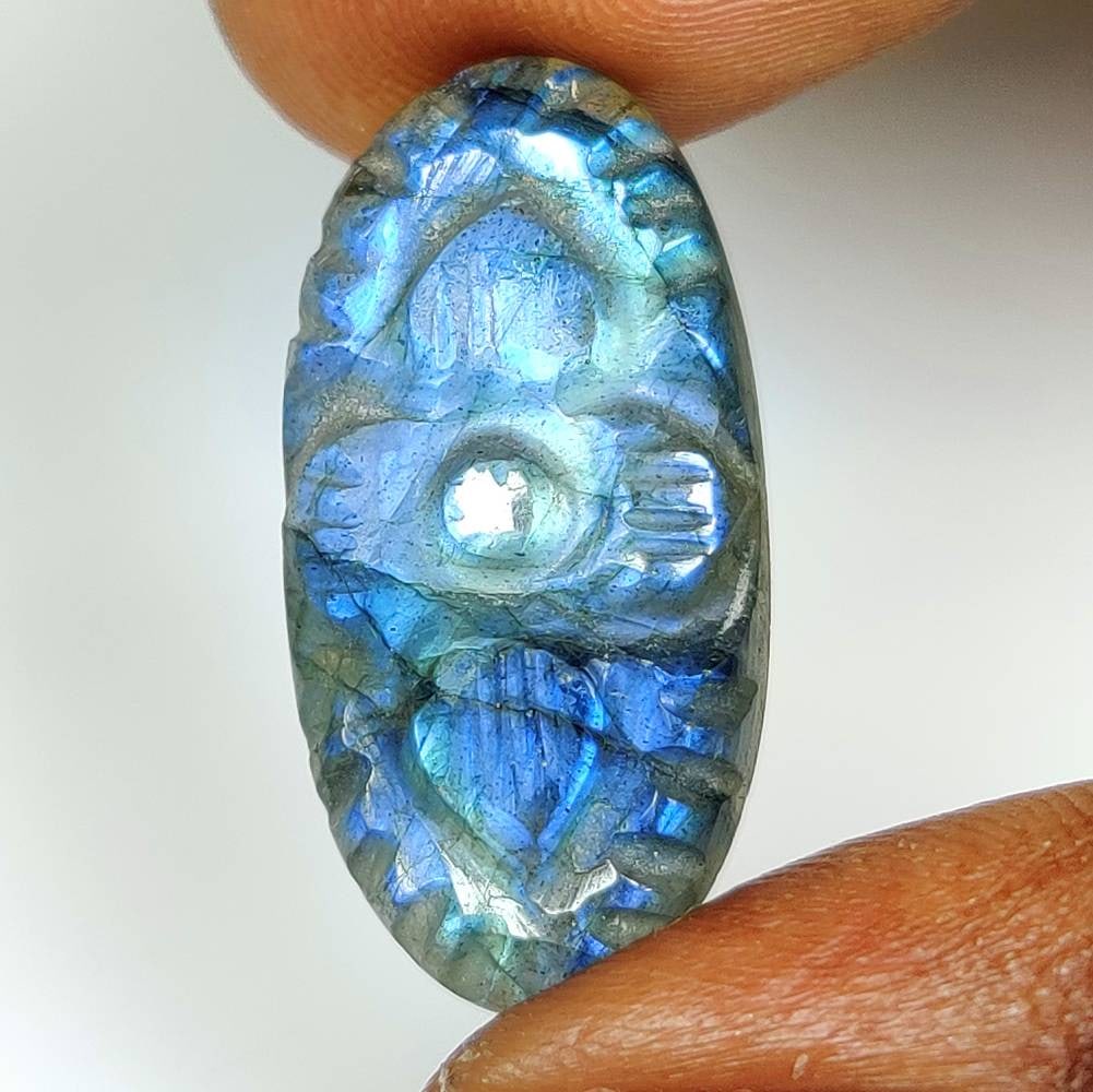 16.68 Ct Natural Blue Shaded Labradorite Oval Cab: Weight - 16.68 Ct / Dimensions - 27.00 x 12.80 x 6.30 mm / Shape - Excellent Oval Cab / Clarity - Opaque / Origin - Africa / Treatment - None