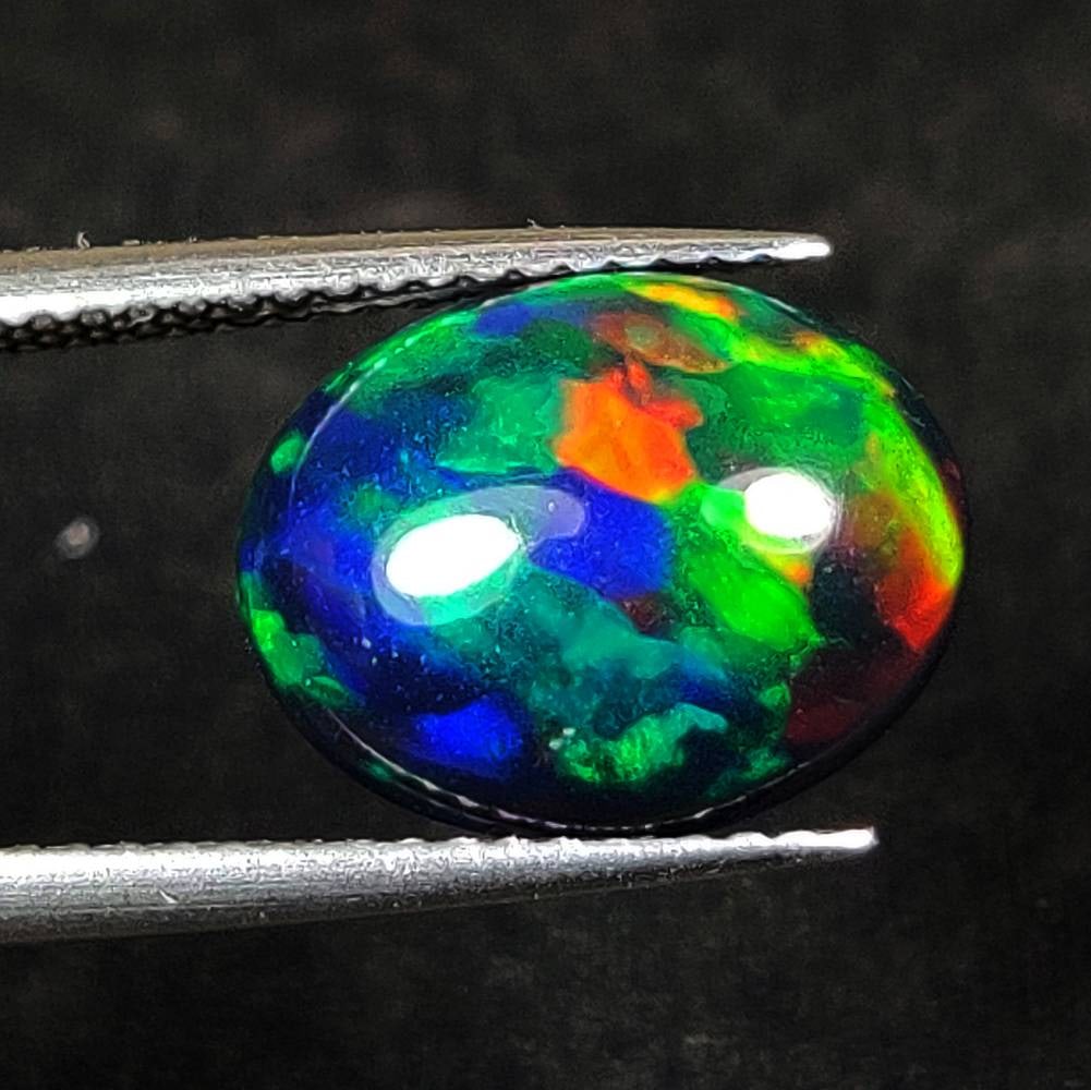 3.12 Ct Natural Black Flashing Fire Opal Oval Cab (1 of 2)