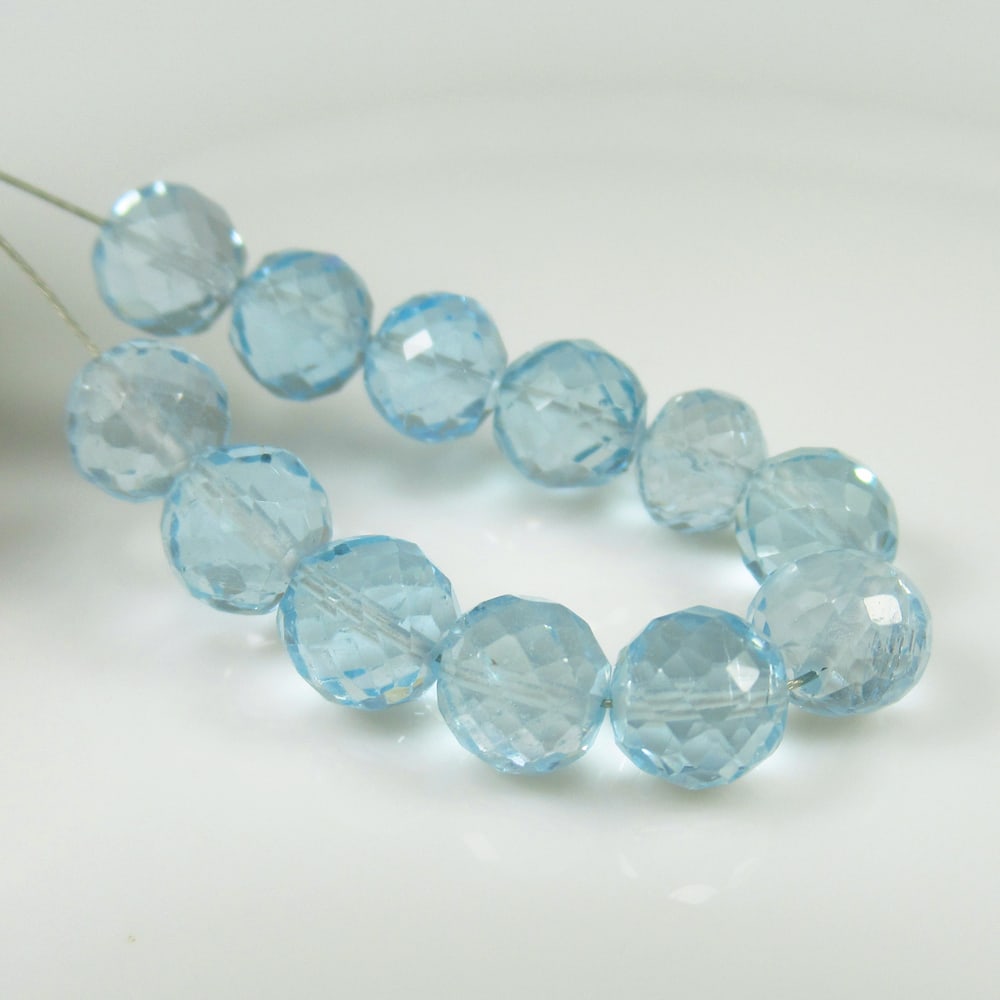 24.78 Ct Natural Blue Topaz Faceted Round Ball Beads: Weight - 24.78 Ct / Dimensions - 6.00 - 6.30 mm / 12 Pc's / Shape - Round Drilled / Color - Blue / Clarity - Transparent / Origin - Brazil / Treatment - Irradiated
