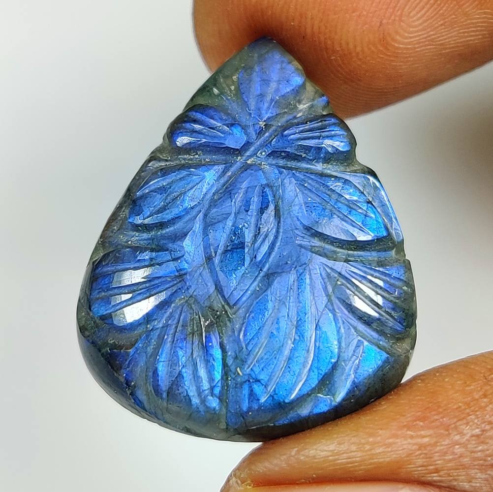27.19 Ct Natural Blue Shaded Labradorite Pear Carving Cab: Weight - 27.19 Ct / Dimensions - 28.00 x 20.50 x 7.00 mm / Shape - Excellent Pear Carving Cab / Clarity - Opaque / Origin - Africa / Treatment - None