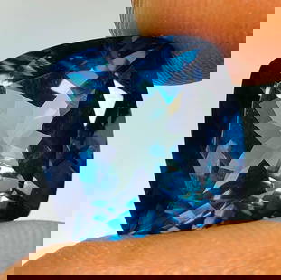 15.03 Ct Natural London Blue Topaz Cushion Cut: Weight - 15.03 Ct / Dimensions - 13.90 x 13.70 x 9.70 mm / Shape - Cushion Cut / Color - Blue / Clarity - VVS / Origin - Brazil / Treatment - Irradiated