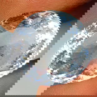 22.53 Ct Natural Colorless Quartz Oval Cut: Weight - 22.53 Ct / Dimensions - 19.60 x 18.00 x 11.20 mm / Shape - Oval Cut / Color - White / Clarity - VVS / Origin - Brazil / Treatment - None