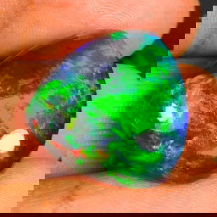21.81 Ct Natural Black Fire Opal Trillion Cab: Weight - 21.81 Ct / Dimensions - 2.50 x 22.20 x 9.40 mm / Shape - Trillion Cab / Color - Black / Clarity - Translucent / Origin - Ethiopia / Treatment - Color Smoked