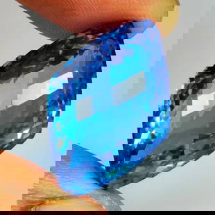 29.97 Ct Natural Blue Topaz Fancy Cut: Weight - 29.97 Ct / Dimensions - 26.00 x 15.90 x 11.80 mm / Shape - Fancy Cut / Color - Blue / Clarity - VVS / Origin - Brazil / Treatment - Irradiated