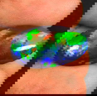 12.46 Ct Natural Black Fire Opal Oval Cab: Weight - 12.46 Ct / Dimensions - 25.00 x 14.20 x 7.10 mm / Shape - Oval Cab / Color - Black / Clarity - Translucent / Origin - Ethiopia / Treatment - Color Smoked