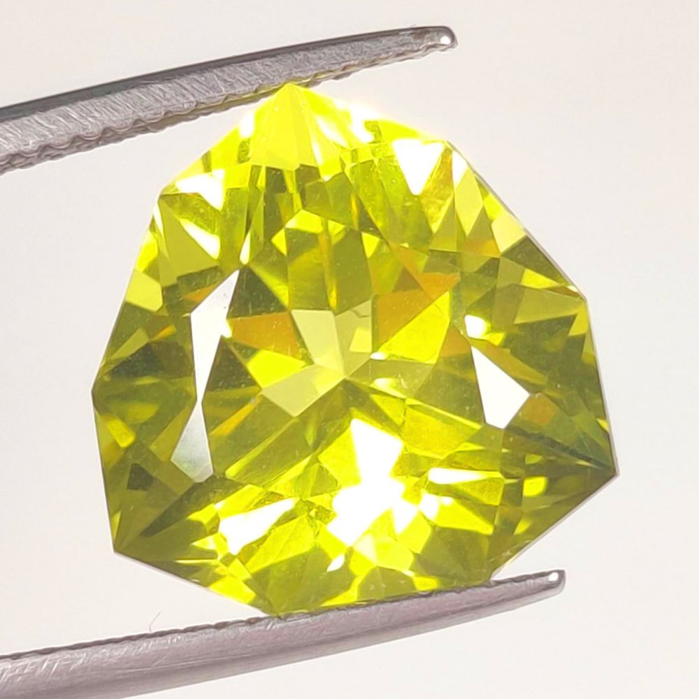 9.80 Ct Natural Lemon Quartz Trillion Modified Cut: Weight - 9.80 Ct / Dimensions - 14.20 x 14.20 x 10.20 mm / Top Quality Luster / Excellent Trillion Cut / Origin - Brazil / Comments - Heated