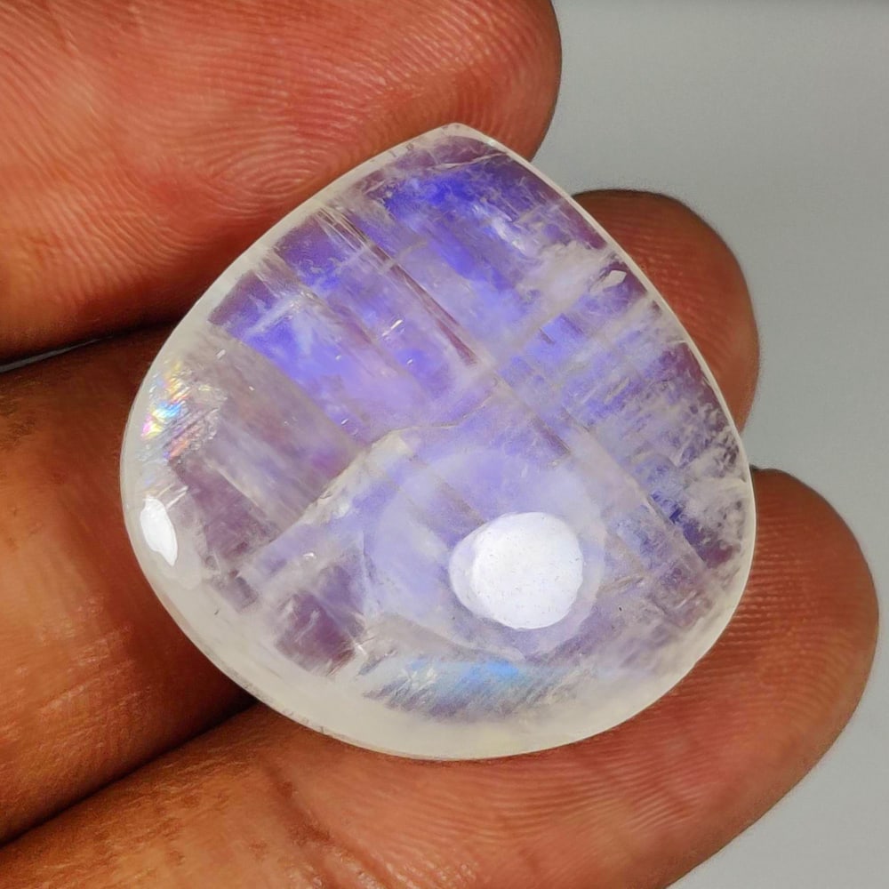 31.85 Ct Natural Blue Tint Moonstone Pear Cab: Weight - 31.85 Ct / Size - 25.00 x 25.00 x 7.70 mm / Shape - Pear Cab / Clarity - Semi-Transparent / Origin - India / Treatment - None