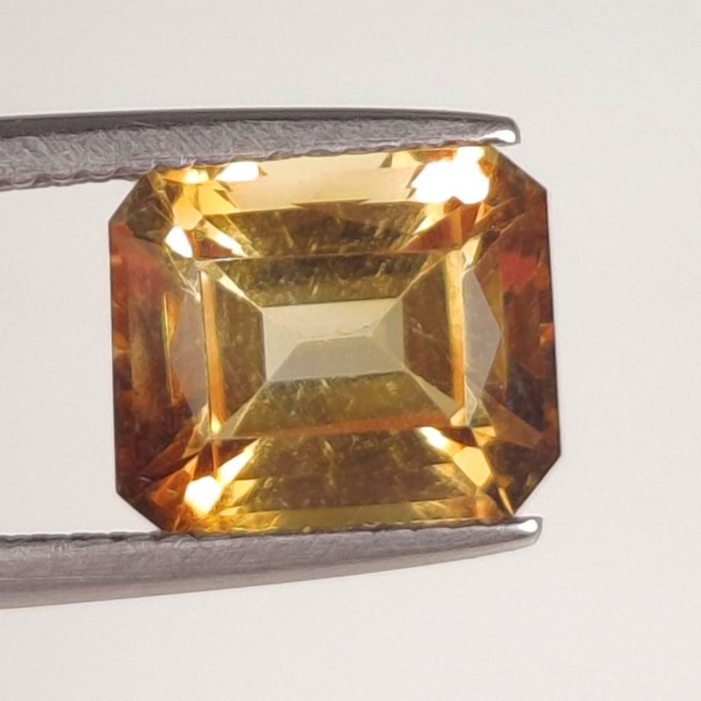 4.40 Ct Natural Color Coated Topaz Emerald Cut: Weight - 4.40 Ct / Size - 9.10 x 6.70 x 7.50 mm / Shape - Emerald Cut / Color - Brown / Clarity - VVS / Origin - Brazil / Treatment - Color Coated