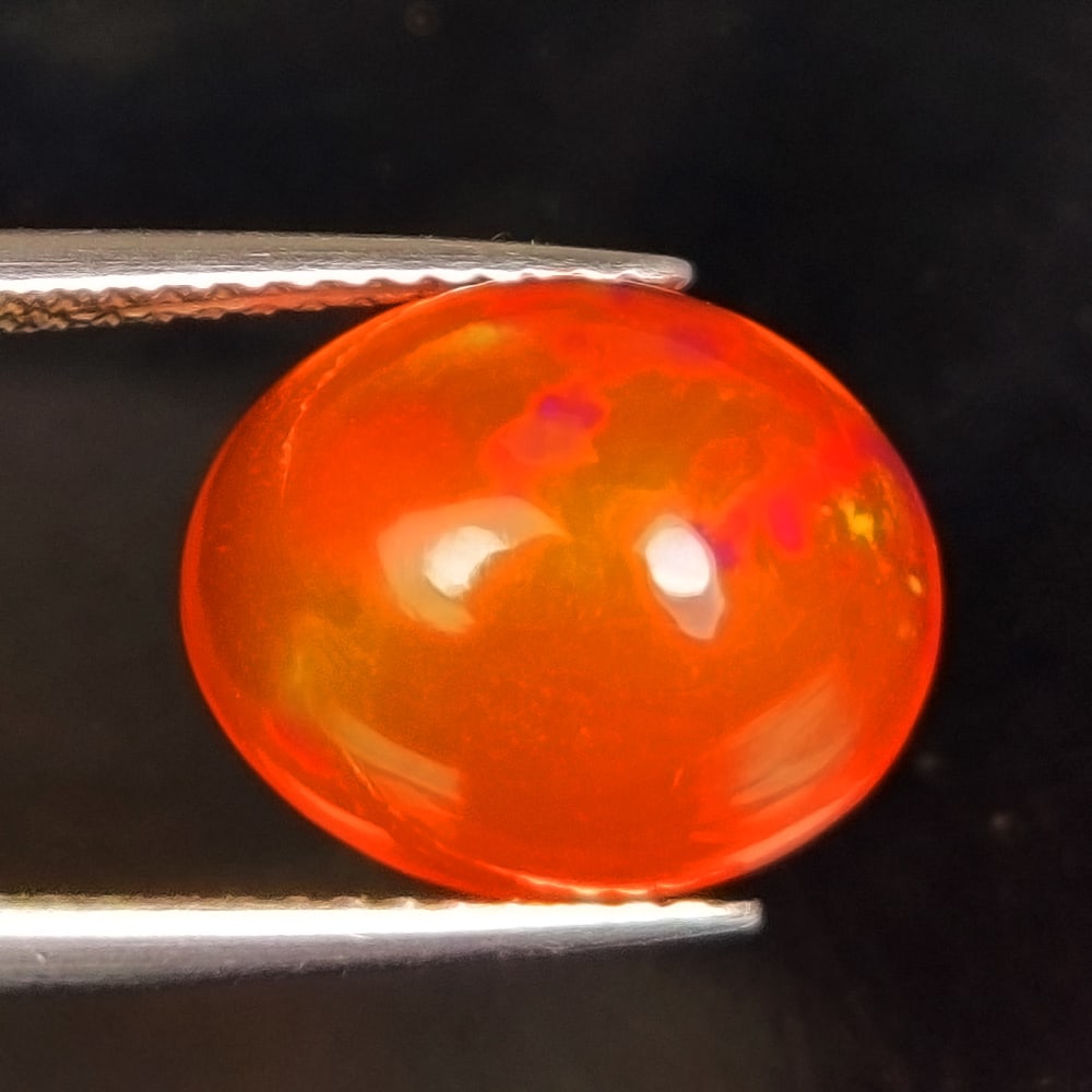 3.81 Ct Natural Orange Fire Opal Oval Cab: Weight - 3.81 Ct / Dimensions - 12.10 x 10.20 x 6.30 mm / Shape - Oval Cab / Clarity - Translucent / Origin - Ethiopia / Treatment - Heated