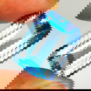 19.91 Ct Natural Blue Topaz Octagon Cut: Weight - 19.91 Ct / Size - 18.20 x 13.20 x 8.90 mm / Shape - Octagon Cut / Color - Blue / Clarity - VVS / Origin - Brazil / Treatment - Irradiated