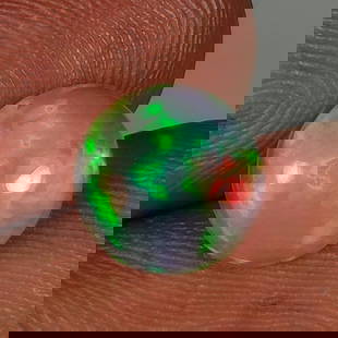 1.60 Ct Natural Multicolor Welo Opal Flash Fire Round Cab: Weight - 1.60 Ct / Dimensions - 9.50 x 9.50 x 4.10 mm / Shape & Cut - Round Cab / Color - Multicolor / Transparency - Translucent / Origin - Ethiopia / Comments - None