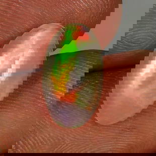 1.79 Ct Natural Multicolor Welo Opal Flash Fire Oval Cab: Weight - 1.79 Ct / Dimensions - 13.00 x 7.50 x 3.70 mm / Shape & Cut - Oval Cab / Color - Multicolor / Transparency - Translucent / Origin - Ethiopia / Comments - None