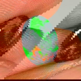 1.52 Ct Natural Black Fire Opal Oval Cut: Weight - 1.52 Ct / Size - 11.10 x 7.90 x 4.20 mm / Shape - Oval Cut / Color - Black / Clarity - Translucent / Origin - Ethiopia / Treatment - Heated