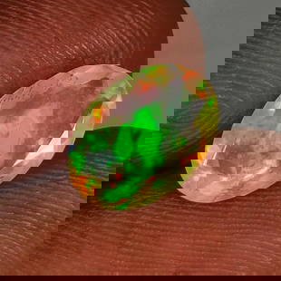 1.56 Ct Natural Multi-Color Welo Opal Flash Fire Oval Cut: Weight - 1.56 Ct / Size - 10.90 x 7.80 x 4.40 mm / Shape - Oval Cut / Color - Multicolor / Clarity - Translucent / Origin - Ethiopia / Treatment - None