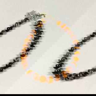 30.36 Ct Natural Tiger Eye Round Beads bracelet: weight - 30.36 Ct / Dimensions - 5.00 - 5.80 mm / 28 Pc's / 7" inches / Shape - Excellent Round Beads / Origin - Burma / Treatment - None