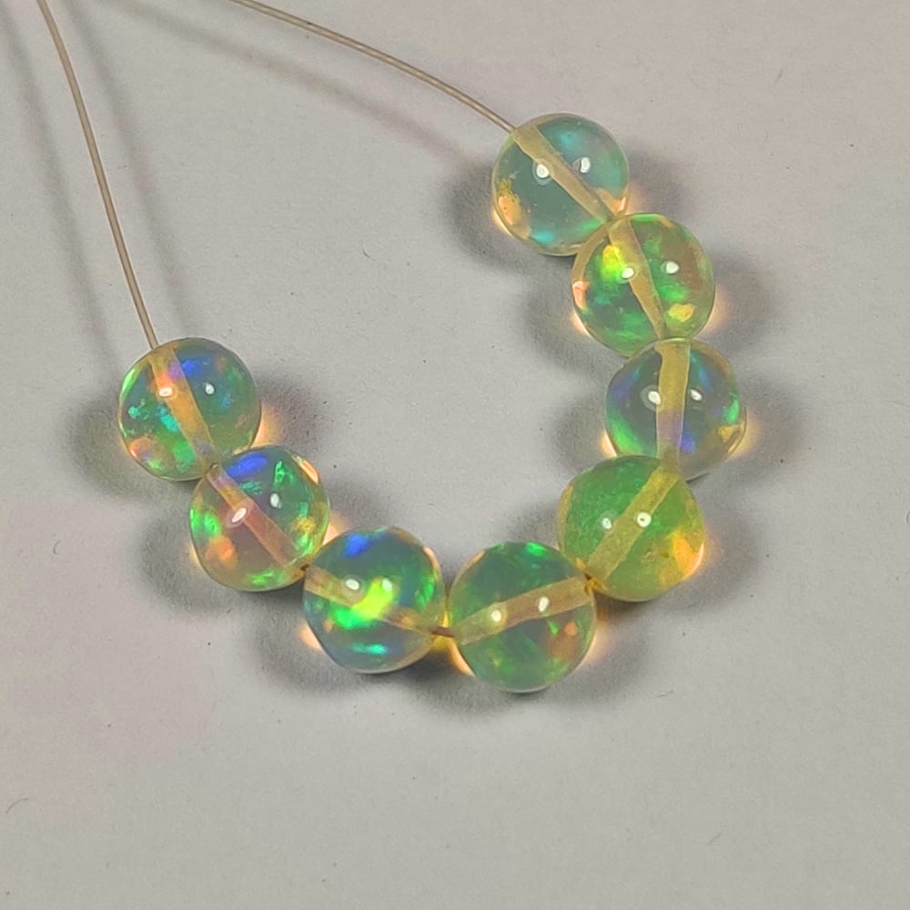 5.10 Ct Natural Multicolor Opal Round Ball Beads: Weight - 5.10 Ct / Dimensions - 4.90 - 5.30 mm / 8 Pc's / Shape - Round Beads / Transparency - Transparent / Origin - Ethiopia / Treatment - None