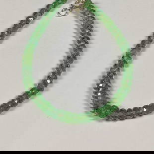 29.89 Ct Natural Green Tourmaline Round Beads Bracelet: Weight - 29.89 Ct / Dimensions - 3.90 - 4.60 mm / 61 Pc's / 6.75" inches / Shape & Cut - Round Cut Beads / Color - Green / Transparency - Transparent / Comments -None