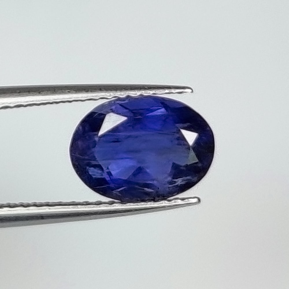 1.74 Ct Natural Deep Violet Iolite Oval Cut: Weight - 1.74 Ct / Dimensions - 9.50 x 7.00 x 4.70 mm / Shape - Oval Cut / Color - Deep Violet / Clarity - SI / Origin - Nigeria / Treatment - None