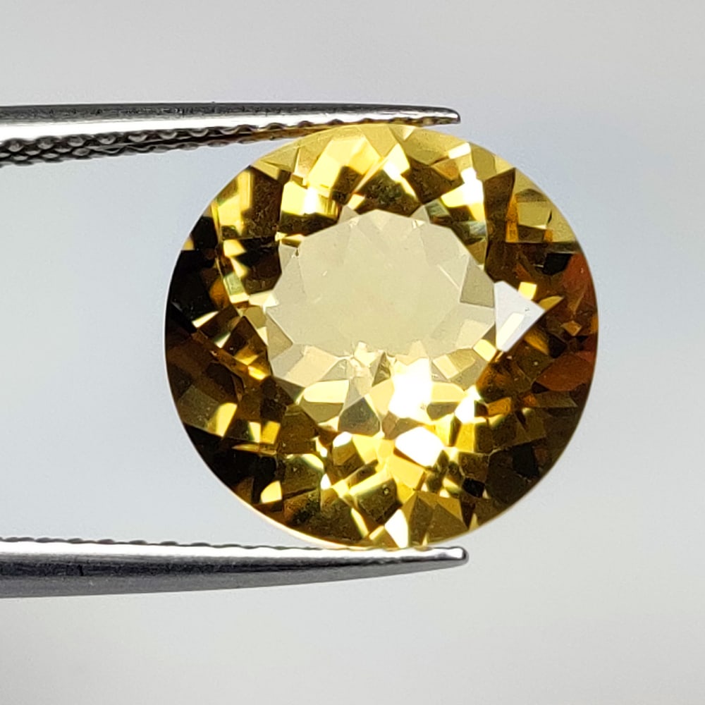 5.20 Ct Natural Yellow Citrine Round Cut: Weight - 5.20 Ct / Dimensions - 11.90 x 11.90 x 7.20 mm / Shape & Cut - Round Cut / Color - Yellow / Transparency - VVS / Origin - Brazil / Comments - Heated