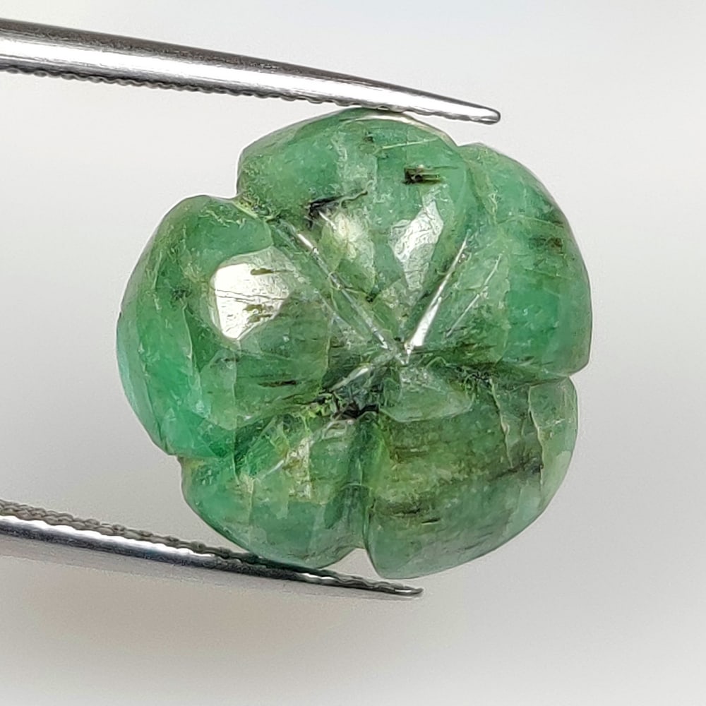 9.32 Ct Natural Green Emerald Fancy Flower Carving: Weight - 9.32 Ct / Size - 15.00 x 14.70 x 6.60 mm / Shape - Fancy Flower Carving / Color - Green / Clarity - SI / Origin - Zambia / Treatment - Natural Emeralds are commonly enhanced by oil