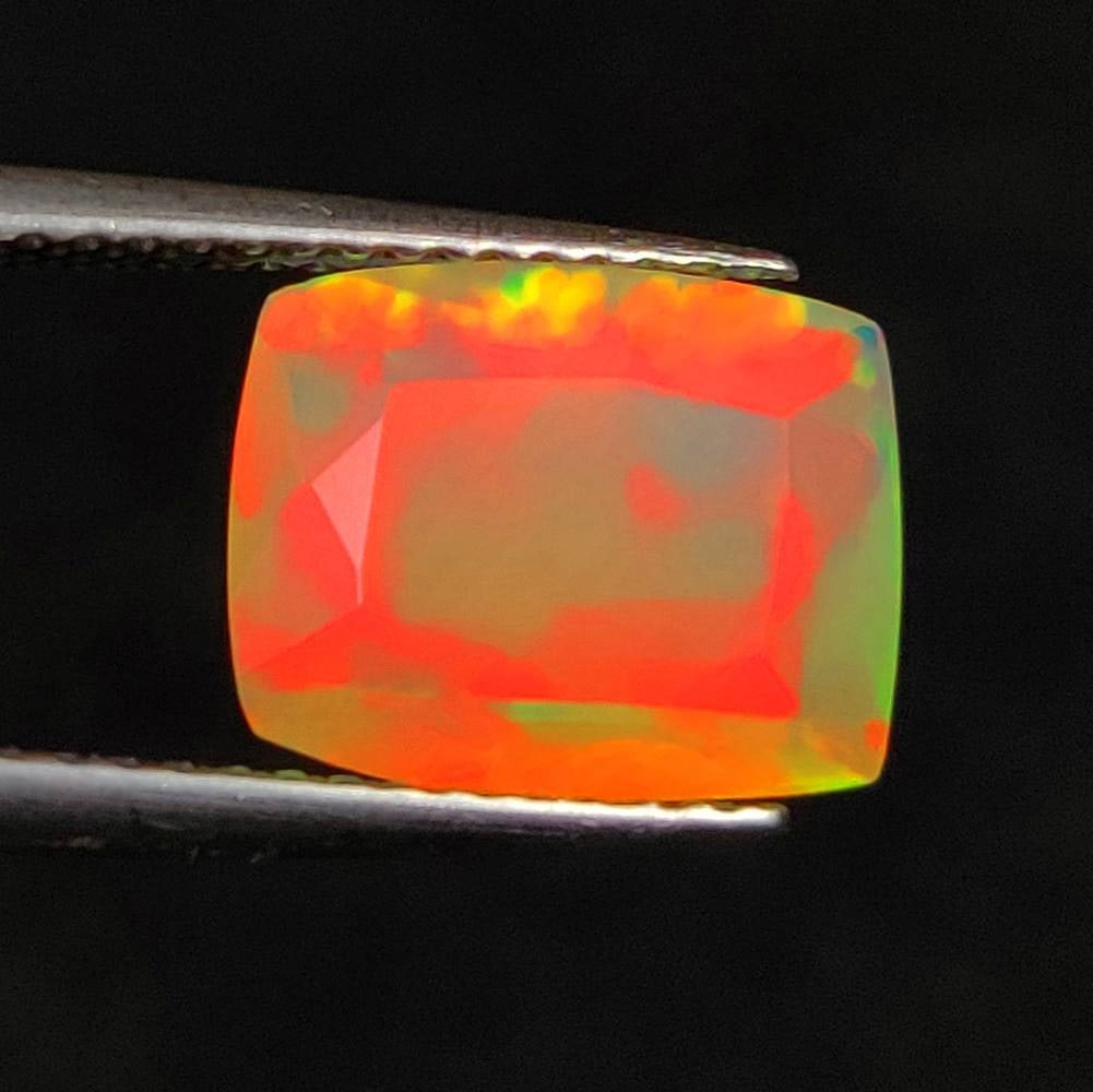 2.37 Ct Natural Multicolor Welo Opal Flash Fire Cushion Cut: Weight - 2.37 Ct / Size - 10.80 x 8.60 x 5.30 mm / Shape - Cushion Cut / Color - Multicolor / Clarity - Translucent / Origin - Ethiopia / Treatment - None