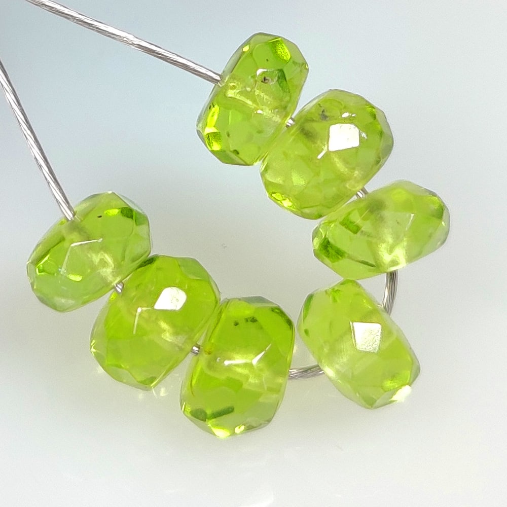 6.83 Ct Natural Green Peridot Round Cut Beads: Weight - 6.83 Ct / Size - 5.30 - 5.60 mm / 7 Pc's / Shape - Round Cut Beads / Color - Green / Clarity - VVS / Origin - Pakistan / Treatment - None