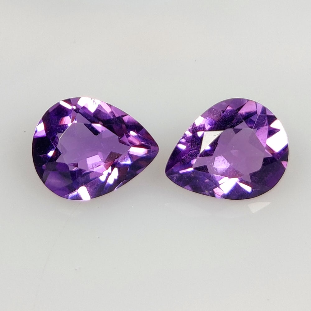 3.93 Ct Natural Purple Amethyst Pear Cut Pair: Weight - 3.93 Ct / Size - 10.00 x 8.00 x 4.90 mm / 2 Pc's / Shape - Pear Cut / Color - Purple / Clarity - VVS / Origin -Brazil / Treatment - Heated