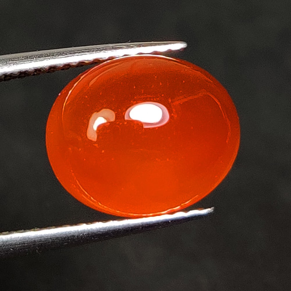 3.94 Ct Natural Carnelian Oval Cab: Weight - 3.94 Ct / Dimensions - 11.20 x 9.20 x 5.20 mm / Shape - Oval cab / Clarity - Semi - Opaque / Origin - Brazil