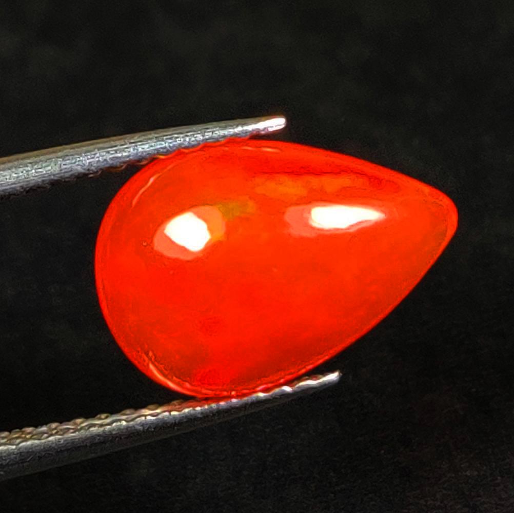 2.16 Ct Natural Orange Flashing Fire Opal Pear Cab: Weight - 2.16 Ct / Dimensions - 12.30 x 8.20 x 5.10 mm / Shape - Pear Cab / Color - Orange / Clarity - Translucent / Origin - Ethiopia / Treatment - Heated