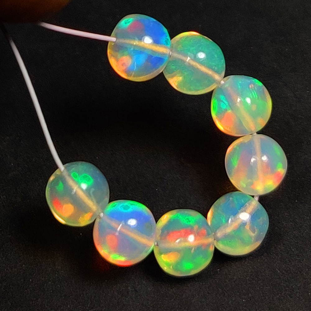 3.11 Ct Natural Multi-Color Welo Opal Round Beads: Weight - 3.11 Ct / Dimensions - 4.30 - 4.70 mm / 8 Pc's / Shape - Round Beads / Color - Multicolor / Clarity - Translucent / Origin - Ethiopia / Comments - None