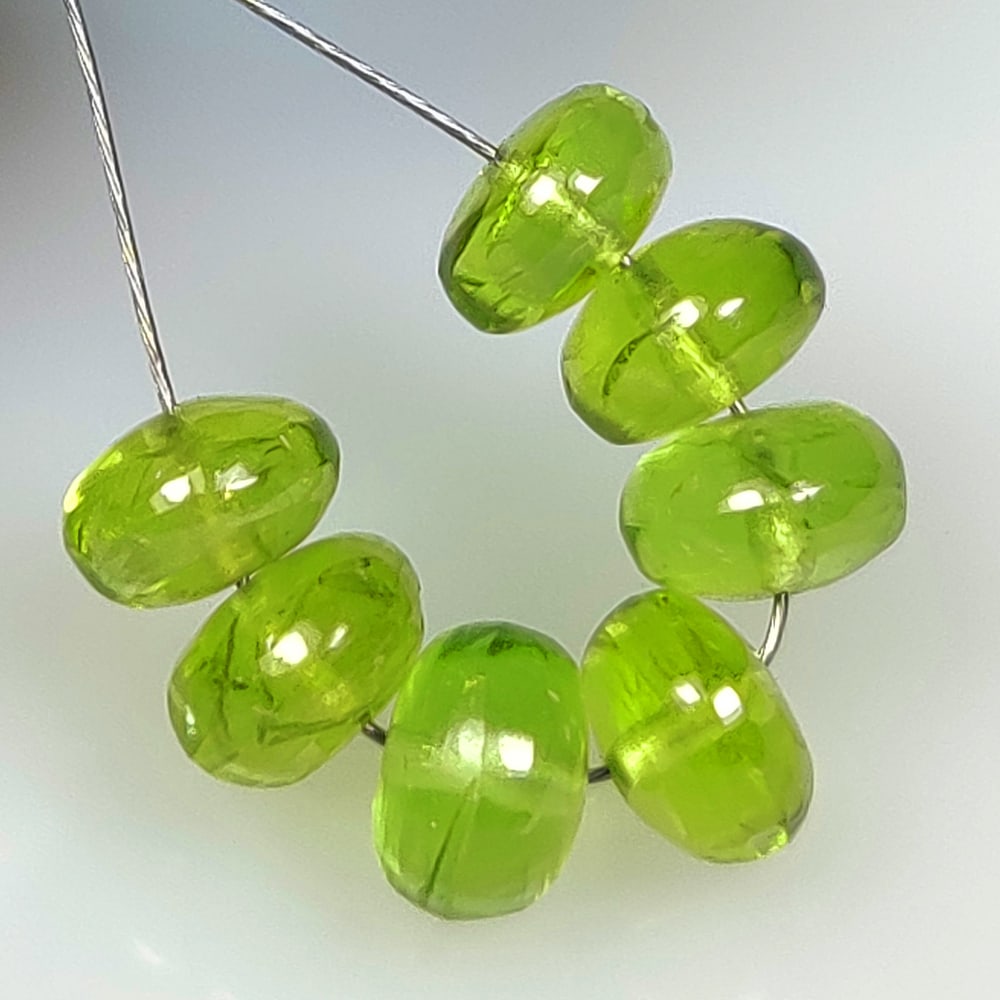 9.48 Ct Natural Green Peridot Round Beads: Weight - 9.48 Ct / Dimensions - 5.80 - 6.20 mm / 7 Pc's / Shape - Round Beads / Color - Green / Clarity - VVS / Origin - Pakistan / Treatment - None