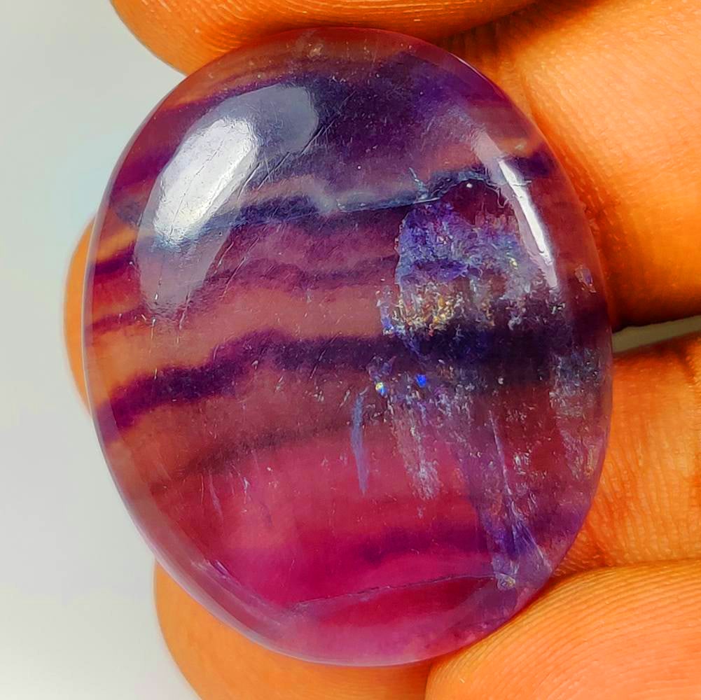 34.74 Ct Natural Purple Rainbow Flourite Oval Cab: weight - 34.74 Ct / Size - 30.00 x 25.00 x 4.90 mm / Shape - Oval Cab / Origin - Brazil / Treatment - None